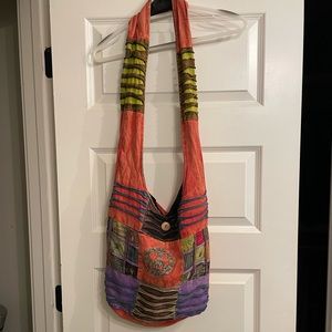 Multicolored peace sign hobo bag